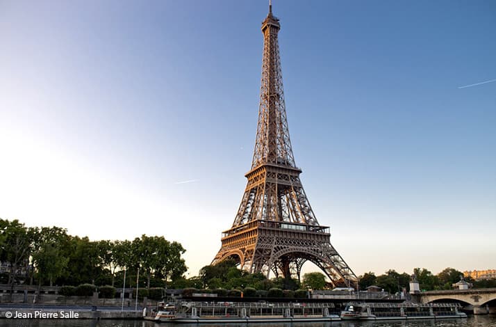 Cruise along the Seine to dinner at the Eiffel Tower